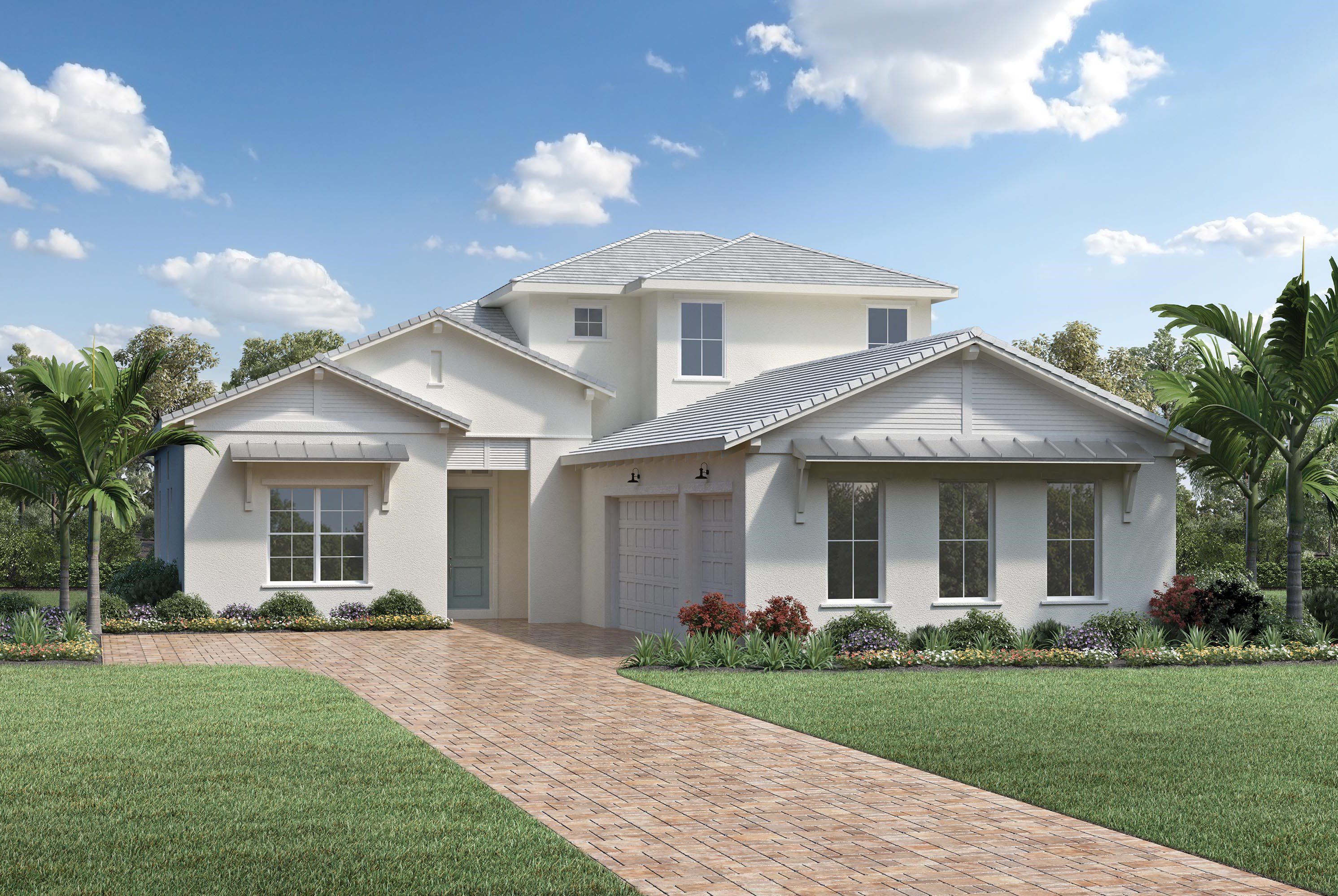 Modern two-story house with white exterior and brick driveway.