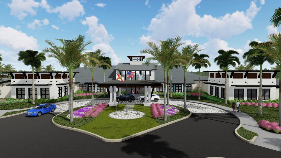 Modern community center with palm trees and colorful landscaping under a bright blue sky.